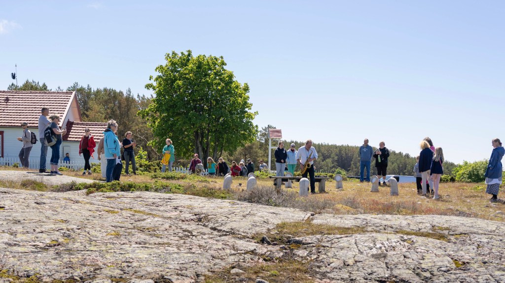 Visitors gathering around the INTER, Jurmo installation during the opening event on Jurmo island.