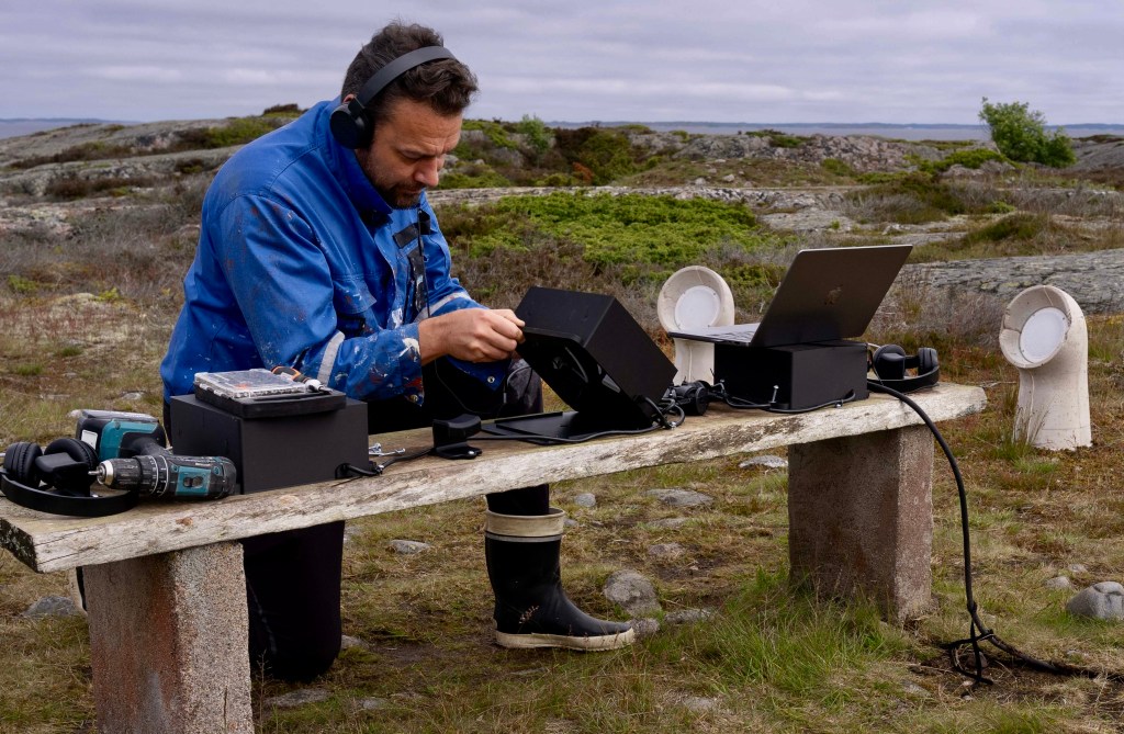 Jaakko Autio working with the INTER, Jurmo installation equipment on site near the chapel and Baltic Sea.
Caption / credit:
Installation process on Jurmo. Photo: Joonas T. Laine.
